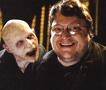 Guillermo del Toro with a monster from PAN'S LABYRINTH